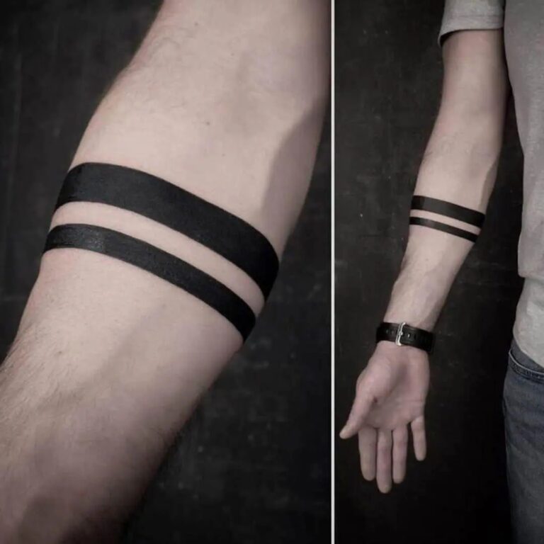 Cosa significa il tatuaggio minimalista a fascia nera sull'avambraccio?